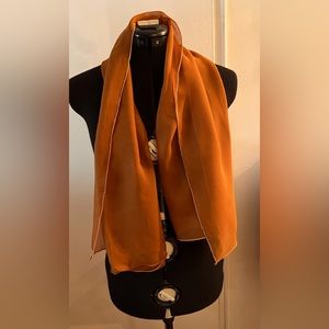 Fashionable, rust colored, see-through scarf